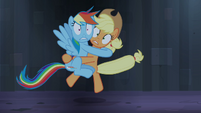 Dashie hugging Applejack.