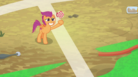 Scootaloo holding up a lollipop S9E22