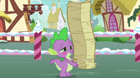 Spike in awe of Rarity while holding flyers S7E9