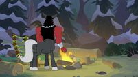 Lord Tirek in front of the campfire S9E8