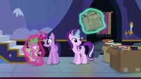 Twilight gently sets Spike on the floor S6E25