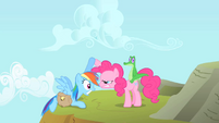 Pinkie Pie stares at Rainbow Dash while helping her up S1E25