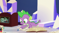 Spike looks at the die roll result S6E17