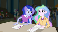 Barely seen in the audience behind Celestia.