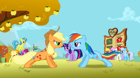 Behind Rainbow Dash's tail.