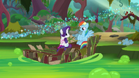 Rainbow and Rarity sitting on the raft S8E17