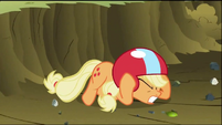 Applejack drops down to the ground for cover from debris created by Rainbow Dash S2E03