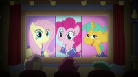 Fluttershy, Pinkie, and Snails see themselves on movie screen S9E6