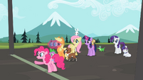 Pinkie notices something in the distance.