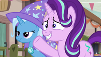 Starlight Glimmer nervously waves to the villagers S6E25