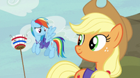 Rainbow and Applejack looking pleased S6E18