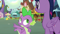 Spike pointing across the marketplace S8E18