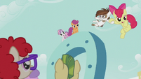 Apple Bloom drops down from giant horseshoe while holding Pipsqueak S5E18