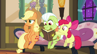 Apple Bloom pointing at yet another photo S3E8