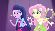 Fluttershy dislodges confetti in Twilight's throat with tambourine EG2