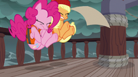 Pinkie Pie and Applejack stumble backward S6E22