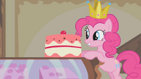 Pinkie Pie standing in front of a cake S1E10