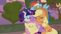 Twilight and her friends in group hug S9E17