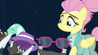 Fluttershy smiling at her raccoon friends S8E4