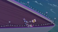 Rarity, Fluttershy, and Pinkie slide to ship's bow EGSB