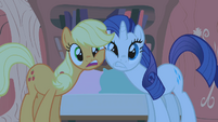 Rarity and Applejack rubbing faces S1E8