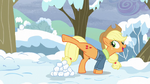 Applejack kicks a snowball at Pinkie Pie S5E5