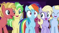 Rainbow Dash pushes through the crowd S8E5