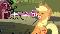 Applejack trying to pull the briars with her teeth.