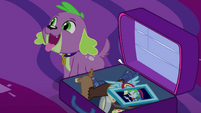 Spike sitting next to Twilight's suitcase EG4