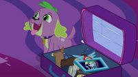 Spike sitting next to Twilight's suitcase EG4