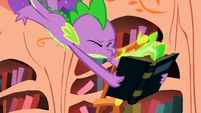 Spike sneezes fire on the book S1E24