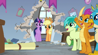 Twilight and AJ surprised; students cheering S8E21