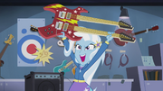 Trixie raising guitar in triumph EG2