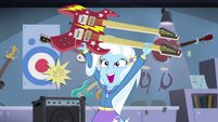 Trixie raising guitar in triumph EG2