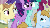 Twilight and Rarity walk through the crowd S8E16