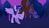 Twilight checking out her new wings