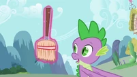 Spike sees the cool broom.