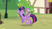 Twilight Sparkle and Spike smiling in Ponyville S6E22