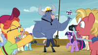 Iron Will holding the race flag; ponies cheering S7E22