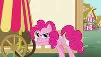 Pinkie Pie trying to get something out of the delivery cart S5E19