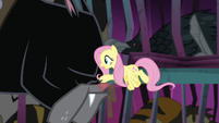 Fluttershy petting one of Cerberus' noses S8E25