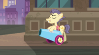Pouch Pony walking away with party cannon S6E3