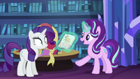 Starlight shows Rarity a picture of a dress S6E21