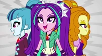 The Dazzlings stand back to back EG2