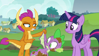 Smolder pointing at Spike's wings S8E24