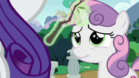 Sweetie Belle's magic brings a great big smile (and wagging tail, too).