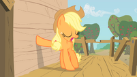 Applejack places her hoof on the tree-house's wall S1E18