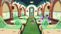 Twilight, Starlight, and Spike in an empty train car S6E16