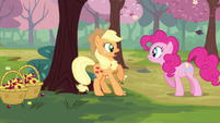 Applejack startled by Pinkie Pie.