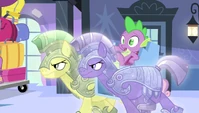 Spike being dragon-napped by two crystal guards